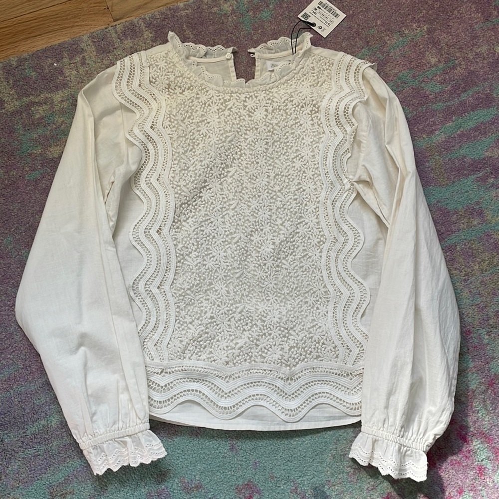 Adorable cream shirt great for a dressing outfit